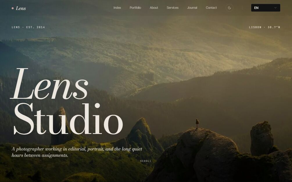 The Lens home page: the words Lens Studio set in large italic serif over a misty mountain landscape, in the editorial-dark theme, with LENS EST. 2014 and LISBON 38.7N markers flanking the nav.