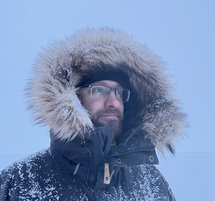 Jussi Niittyviita in a fur-hooded parka in the northern Finnish winter