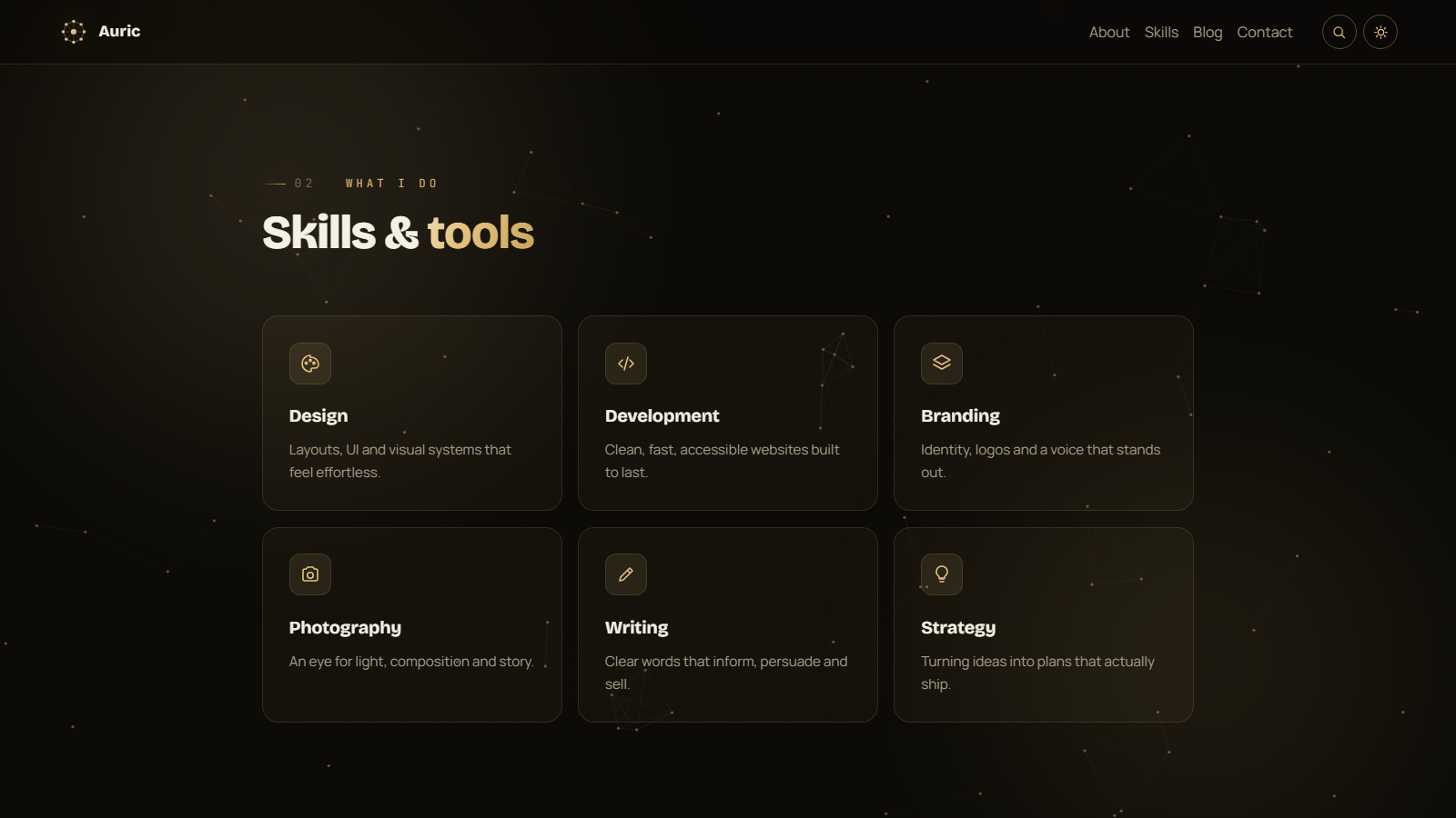 Auric skills section: six cards with icons for Design, Development, Branding, Photography, Writing and Strategy