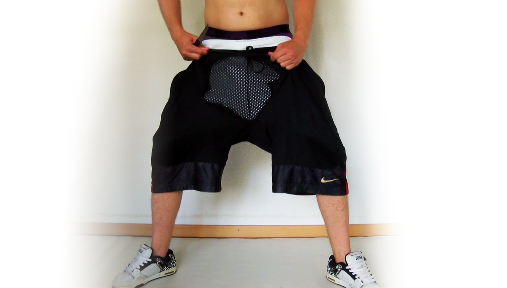 Cutting down some black Nike basketball shorts