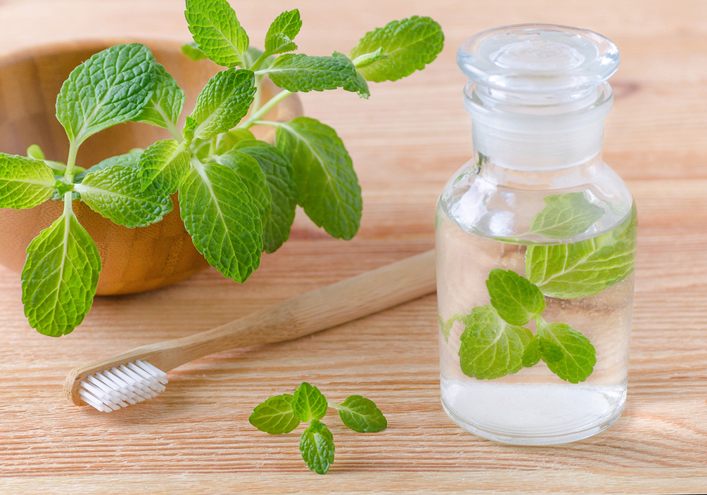 Photo "alternative natural mouthwash bottle with mint and wood
