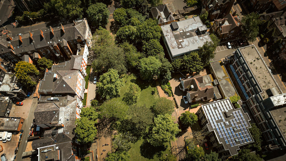 Oval Park's Splendid Greens & Leicester Cityscape Aerial Stock Footage